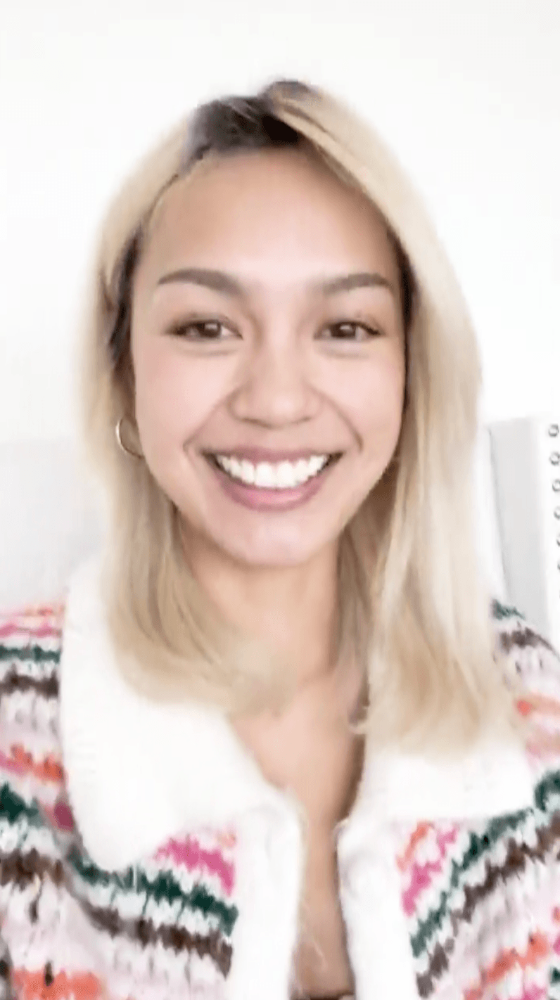 Screenshot of a woman on a video call